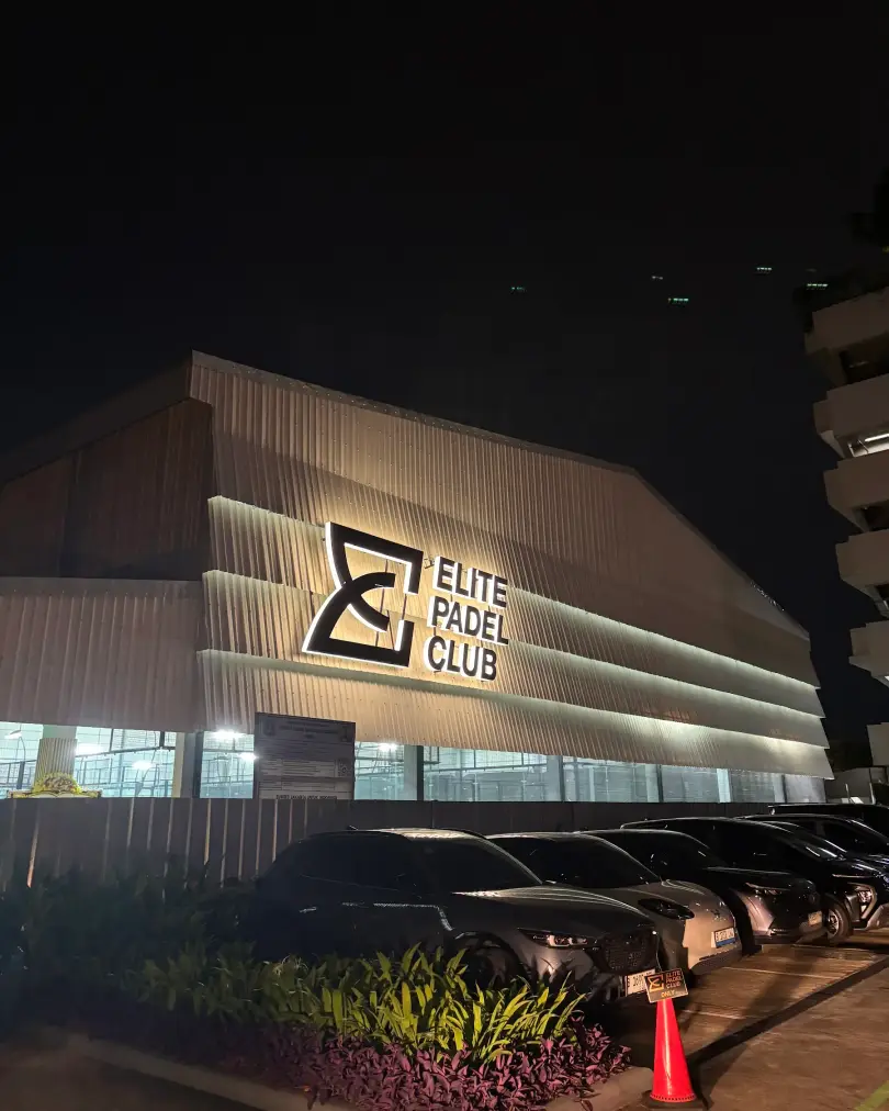 Elite Padel Club facade lit at night