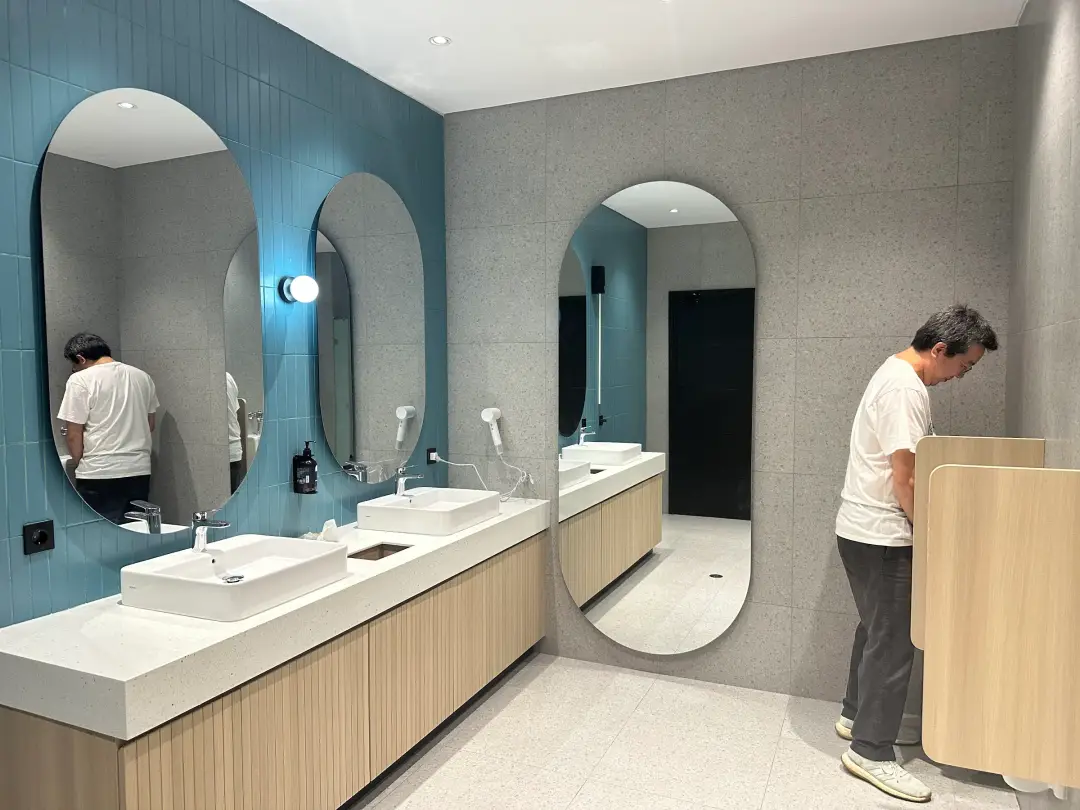 Bathroom with oval mirrors